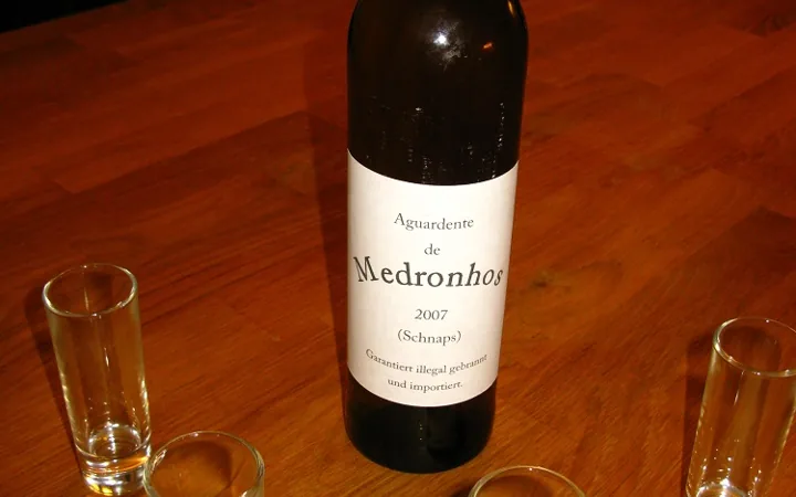 A bottle of home-distilled medronho, the Algarve strawberry-tree spirit