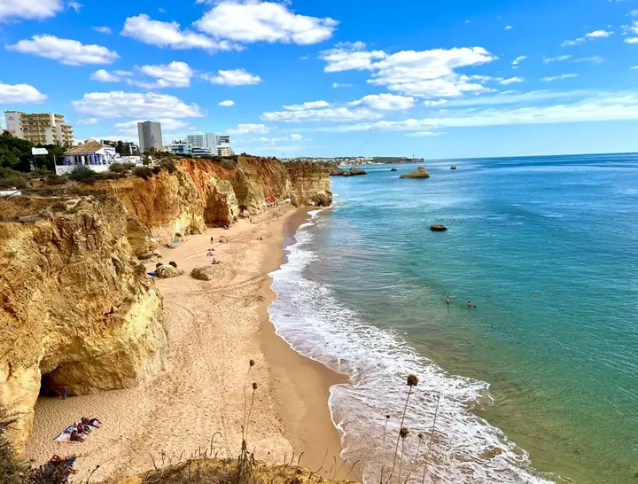 Golden cliffs, arches and turquoise water at Praia da Marinha near Benagil